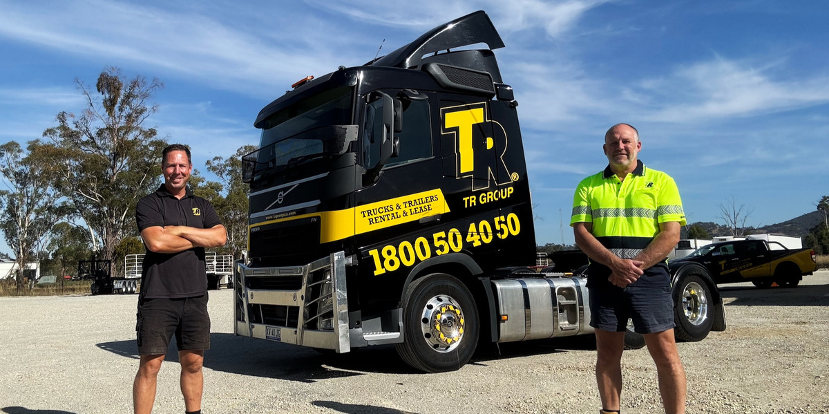 Two TR Group team members standing in front of a TR Group truck with the logo, contact number, and branding clearly visible at the newly opened branch in Albury, NSW.